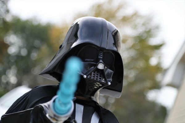 Darth Vader costume with blue lightsaber